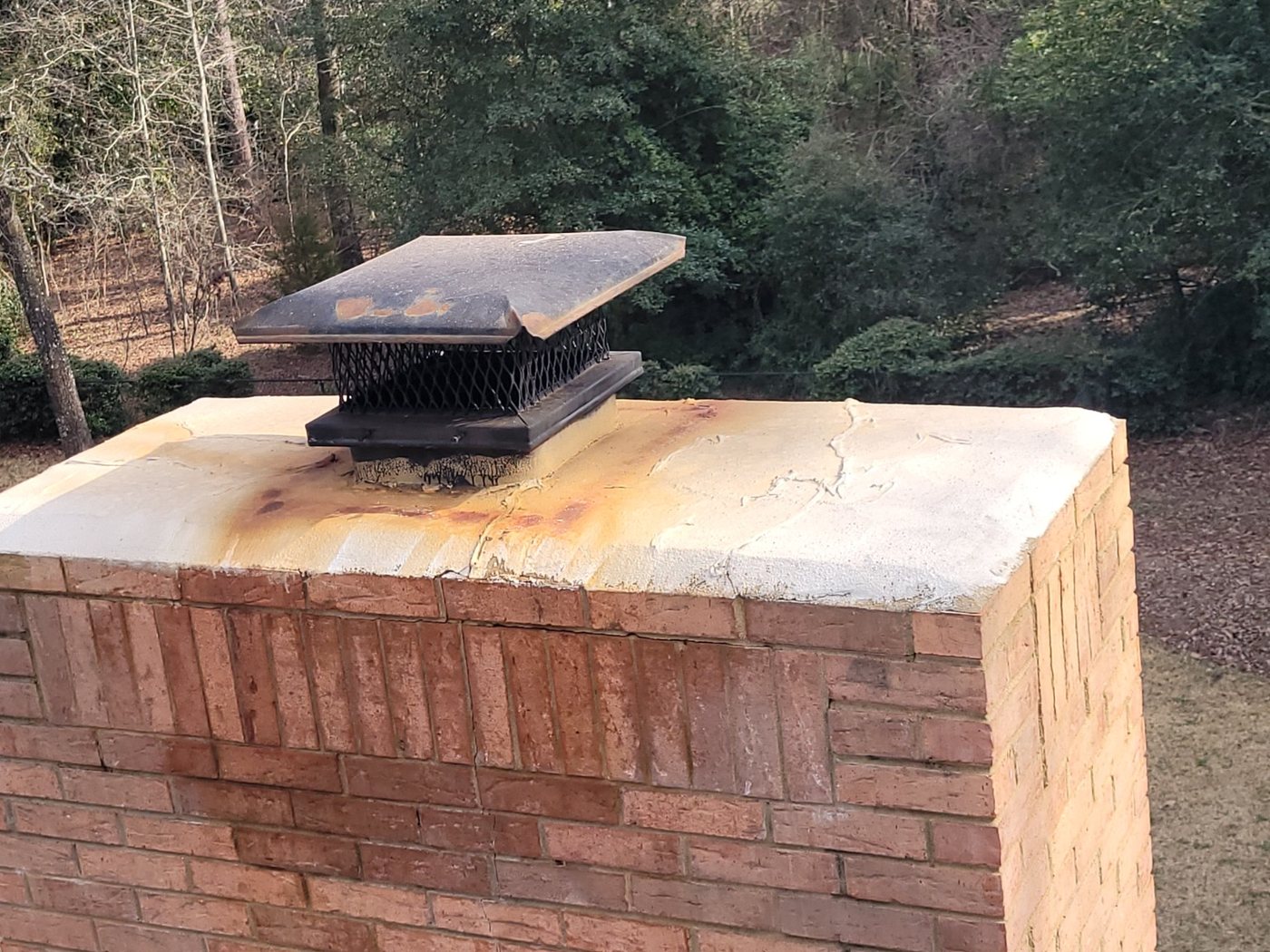 Chimney cap installed on masonry chimney