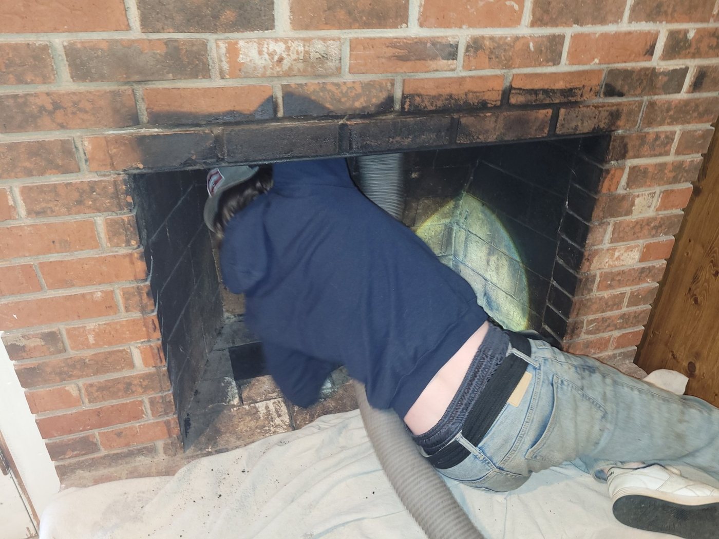Fireplace being professionally cleaned