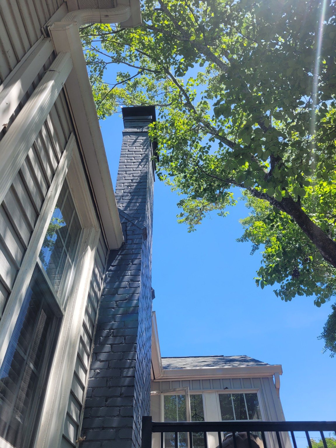 Tall painted chimney with cap