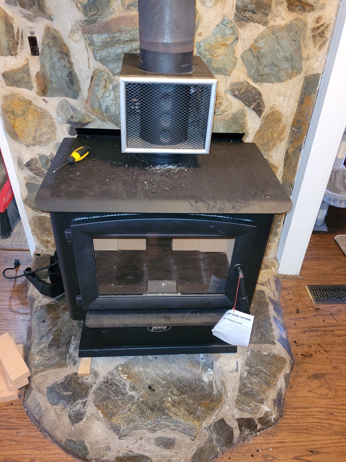 Wood stove and pipe being serviced